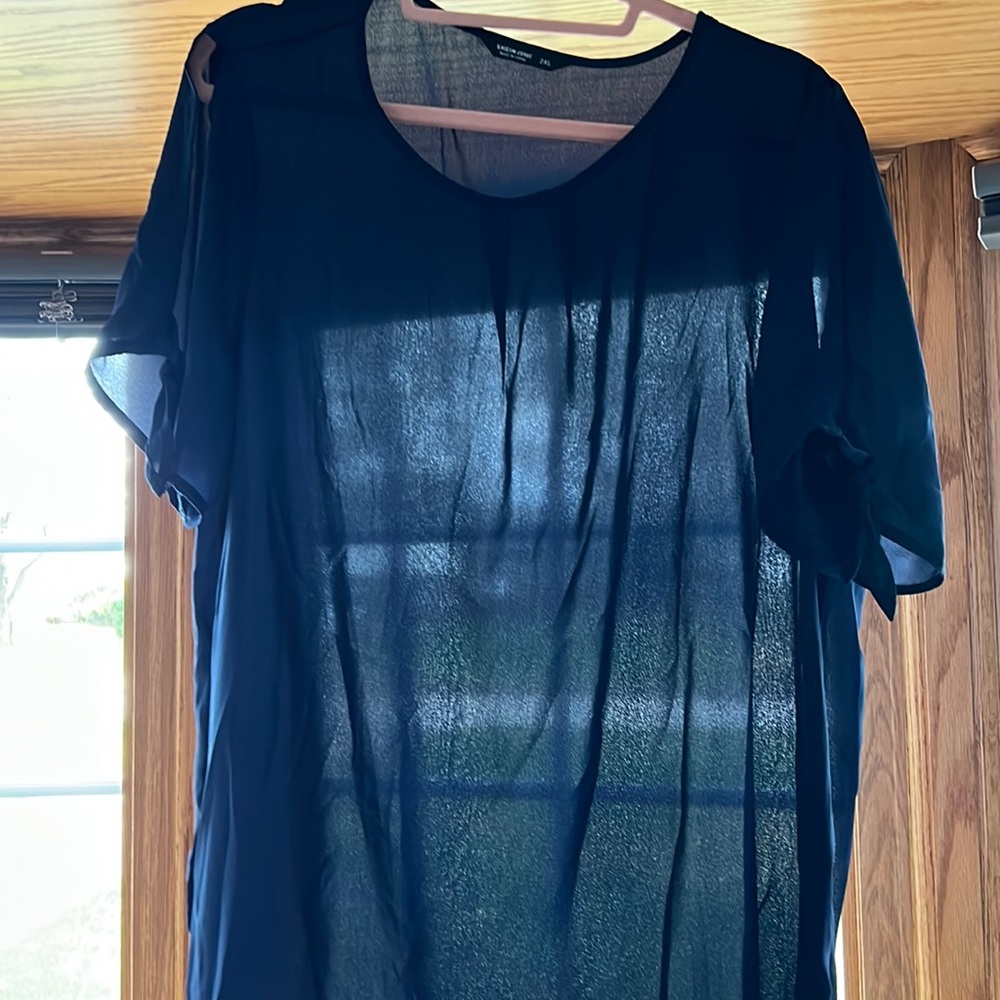 Top not as sheer as photo shows lots of light but would wear a tank underneath